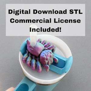 May include: A blue travel mug with a white lid and a 3D printed purple and green spider on top. The text "Digital Download STL Commercial License Included!" is displayed above the mug.