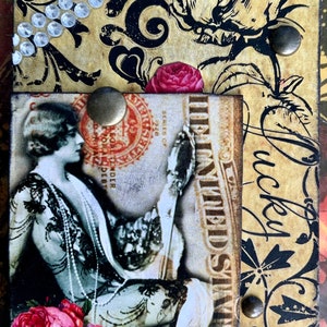 May include: A vintage-style collage with a woman in a black and white dress holding a mirror. The collage includes a rose, a stamp, and the text "lucky love life!"