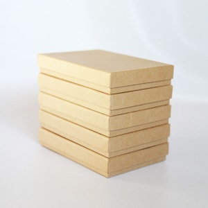 10- Kraft  Boxes filled with cotton  7-1/8" x 5-1/8" x 1-1/8"H   Works great for photography presentation