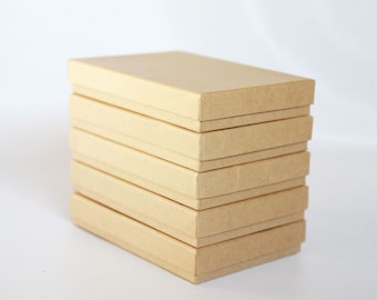 150- Kraft  Boxes filled with cotton  7-1/8" x 5-1/8" x 1-1/8"H   Works great for photography presentation