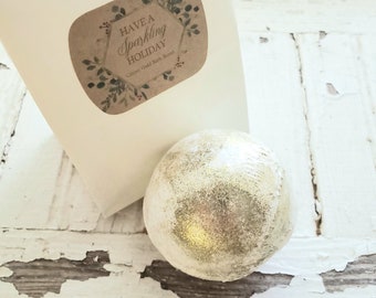 Glitter Gold Holiday Bathbomb - one 4.5 oz - packaged in a white tin-tie bag - Have A Sparkling Holiday sticker