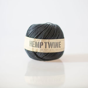 May include: A ball of black hemp twine with a label that reads "HEMP TWINE 1/8 IN (11mm) - 430 FEET (130 M) - 100% HEMP"