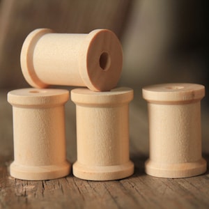 15 natuurlijke houten spoelen: 1 3/16 x 7/8 inch