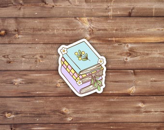 Pegatina de pila de libros en tonos pastel: vinilo floral para amantes de los libros