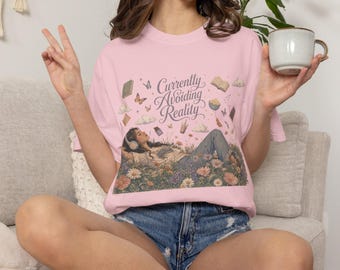 Currently Avoiding Reality T-shirt | Relaxing Woman in Meadow, Floral, Floating Books