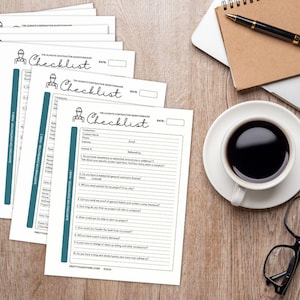 May include: A stack of white checklists with teal accents and the title "Checklist" in cursive. The checklists are on a wooden desk with a cup of coffee, glasses, a pen, and a notebook.