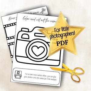 May include: Black and white printable camera colouring page with a heart-shaped lens, part of a photography-themed activity. Includes text: "Color and cut out the camera" and "For little photographers! PDF".