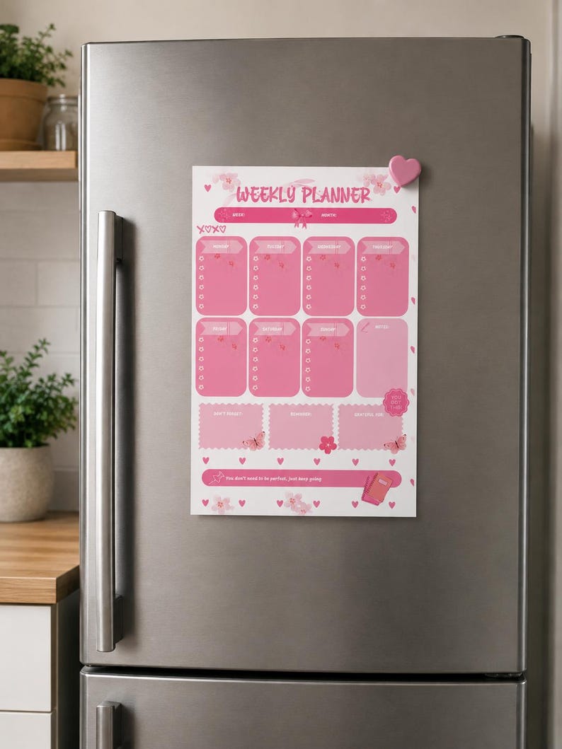 May include: A magnetic weekly planner sheet with a pink color scheme, featuring sections for each day of the week, a notes area, and additional boxes for reminders. The design includes butterfly, flower, and heart graphics with the text Weekly Planner.