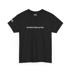 May include: Black t-shirt with white text that reads "OVERStimulated" on the front.