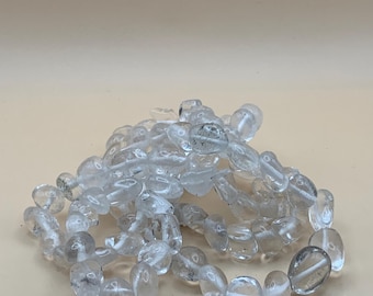 Armband med klar kvartssten och Buddha-motiv