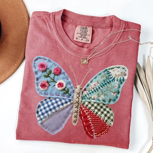 May include: A handmade wooden sign with the text "Welcome" in a playful font. The sign is painted white with a distressed finish, and features a decorative floral design in shades of pink and green. It is designed for indoor or outdoor use.