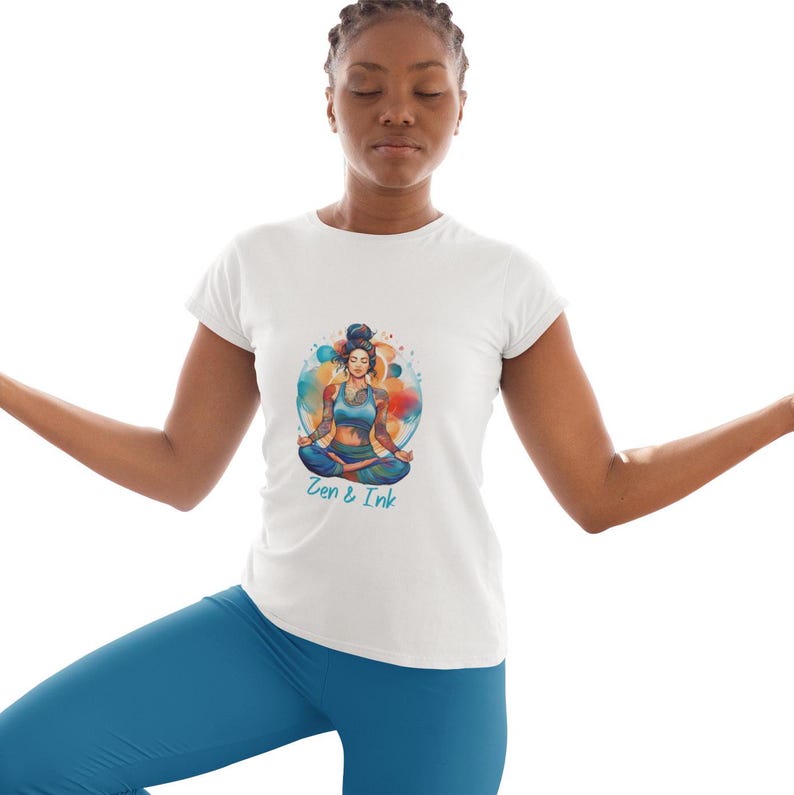 T-shirt with design of woman with tattoos sitting in yoga pose