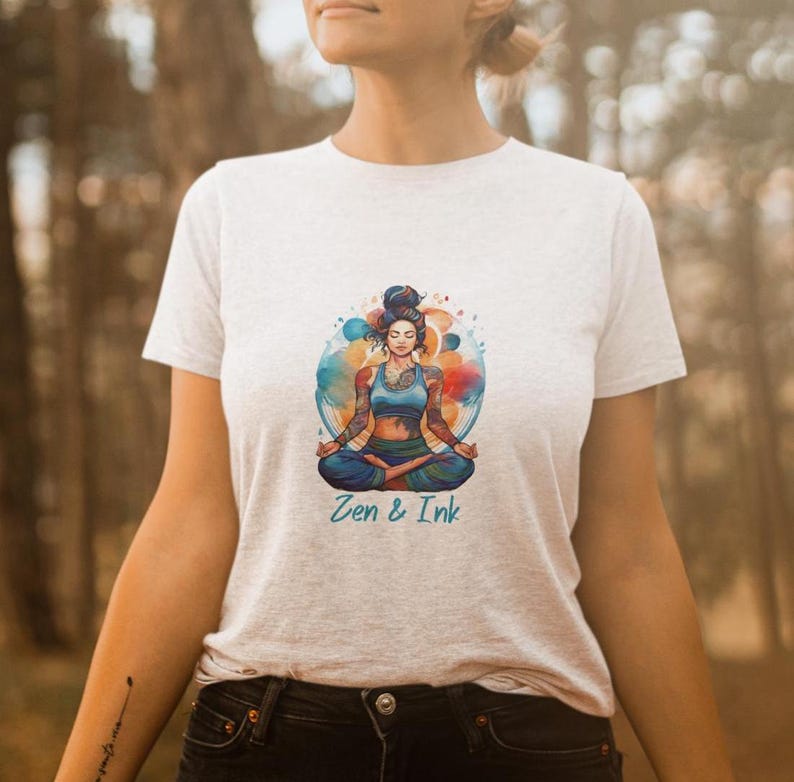 T-shirt with design of woman with tattoos sitting in yoga pose