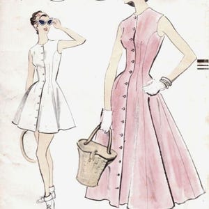 May include: Vintage Vogue pattern cover featuring two women in dresses. One wears a white dress with buttons, sunglasses, and a headband. The other wears a pink dress, holding a basket bag. The text "VOGUE" is at the top.