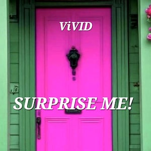 May include: A bright hot pink door set within a sage green wooden frame. The door features a black metal knocker and a black handle. The text ViViD is printed in white above the knocker, and the text SURPRISE ME! is printed in white below it.