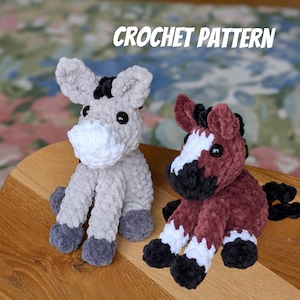 May include: Two crochet animal figures: a grey donkey and a brown horse. The donkey has a white muzzle and black mane. The horse has a white face marking and black mane. The text "CROCHET PATTERN" is above the animals.