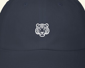 May include: A navy blue baseball cap with a white embroidered tiger face. The cap has a curved peak and an adjustable strap. A fashionable and comfortable accessory for everyday wear.