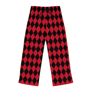 May include: Red and black diamond-patterned pajama pants. The pants have a drawstring waist and a wide-leg design. The harlequin-style pattern is made up of alternating red and black diamond shapes. The fabric appears to be soft and lightweight.