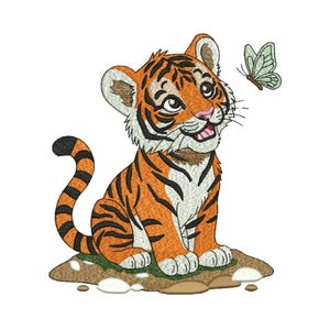 May include: An embroidered design of a cartoon tiger cub with orange and black stripes, sitting on a brown surface. The tiger is looking up at a light green butterfly. The tiger has a pink nose and is smiling.