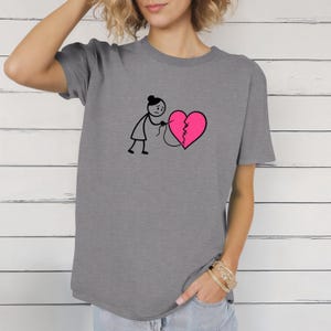 Empowering Woman Who Mends Hearts Tee, Ladies Inspirational Shirt, Healing Feminist Top, Unisex Softstyle T-Shirt, Heartbreak Recovery Gift