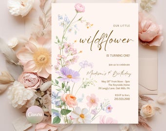 May include: A floral birthday invitation with the text "OUR LITTLE wildflower IS TURNING ONE!" and "Madison's 1st Birthday." The design features watercolor flowers in shades of pink, purple, and peach, with a cream-colored background and an envelope.