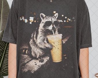 Comfort Colors Raccoon Drinking Iced Coffee Shirt, Funny Animal Meme Tee, Coffee Lover Raccoon Shirt, Gift For Women and Man Unisex T-Shirt