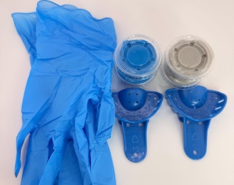 May include: A pair of blue nitrile gloves, two small clear plastic containers with blue and grey putty, and two blue plastic dental impression trays. Each tray features a perforated arch design and a handle marked with the number 10.