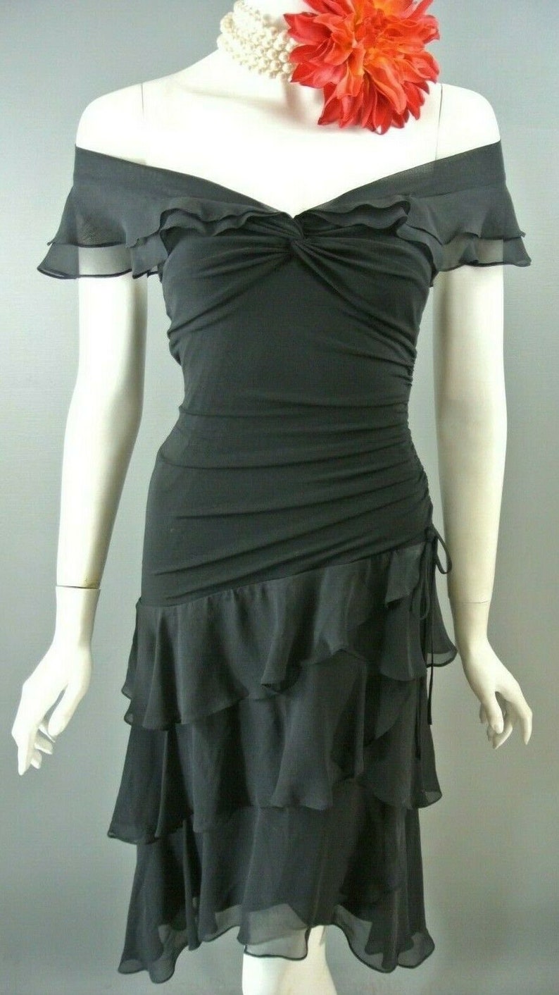 black blouse with red skirt