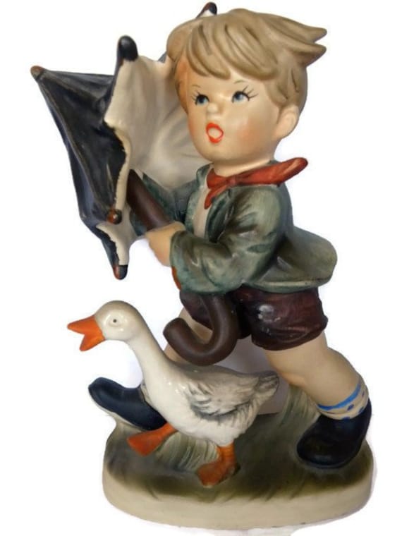 hummel boy with bird on foot