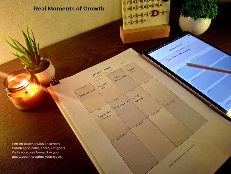 Lifestyle photo of digital planner on tablet (Samsung Notes/GoodNotes) and printed yearly planner. Styled with candlelight and desk plants. Perfect for cozy journaling, vision board set, goal roadmap, and productivity tools.