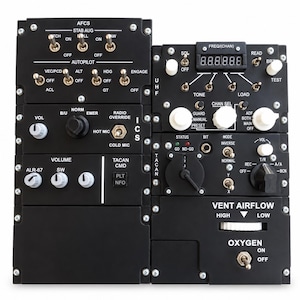 May include: A black aircraft cockpit control panel assembly featuring multiple toggle switches, rotary knobs, and digital displays. Labels include AFCS, ICS, TACAN, VENT AIRFLOW, and OXYGEN. The unit is secured with visible silver screws at the corners.