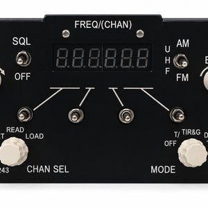 May include: A black radio control panel featuring a digital frequency display, two white knobs for volume and brightness, and multiple toggle switches. The panel includes labels such as FREQ/(CHAN), SQL, V/U/H/F, AM/FM, PRESET, CHAN SEL, and MODE.
