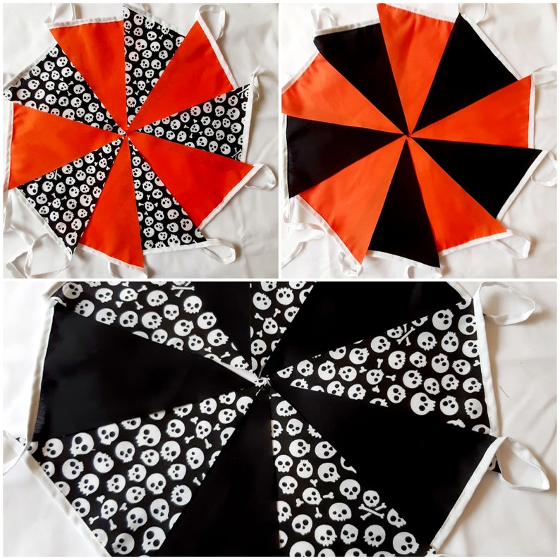 May include: Halloween-themed bunting flags in three arrangements. The flags feature orange, black, and skull-patterned fabric. Each flag is triangular, with white trim and ties for hanging. The bunting is suitable for festive decorations.
