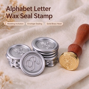 May include: An alphabet letter wax seal stamp with a solid brass head and a wooden handle, accompanied by several silver-colored wax seals featuring the letter R. The text Alphabet Letter Wax Seal Stamp, Wedding Invitation, Envelope Sealing, Solid Brass Head is visible.