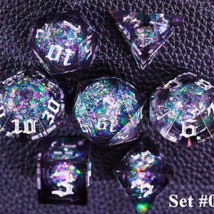 May include: A set of seven polyhedral dice with a dark purple, glittery interior and white numbering. The dice are in various geometric shapes, including a d4, d6, d8, d10, d12, d20, and a percentile die. The text "Set #01" is in the bottom right corner.
