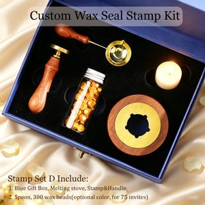 May include: A Custom Wax Seal Stamp Kit in a blue box containing a wooden-handled stamp, a gold-toned melting spoon, a glass vial of yellow wax beads, a wooden melting stove, and a white tea light candle. Text reads Custom Wax Seal Stamp Kit.