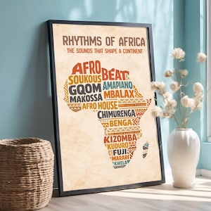 May include: Framed art print titled "Rhythms of Africa" with a map of Africa. The map is filled with colorful text representing various music genres. The frame is black, and the background is a light beige color. The print is displayed near a white vase with dried flowers.