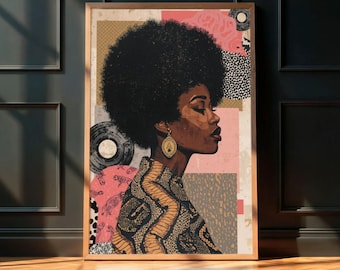 May include: A framed art print featuring a profile of a Black woman with a large afro. The artwork has a collage-style background with pink, beige, and patterned elements. The woman wears gold earrings and a patterned top. The frame is a light brown color.