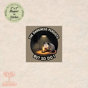 May include: A round sticker or magnet with the text "5" x 5" Magnet or Sticker". The main image is a cartoon opossum holding a candle with the text "THE DARKNESS PERSISTS BUT SO DO I".