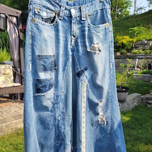 Kreolka True Religion tattered and torn denim skirt, patchwork, pockets, frayed, distressed by time, worn out, artfully destroyed, long