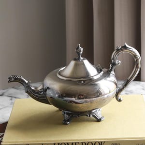 Vintage Silver Teapot with Ornate Handle and Footed Base – EP Zinc Alloy Silverplate