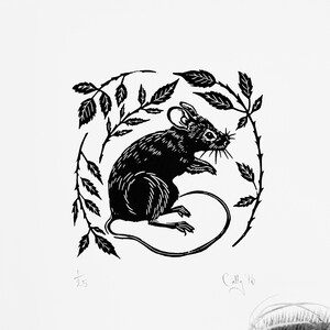 May include: Black and white linocut print of a mouse sitting in a circle of leaves. The print is signed "Calle 16" in the bottom right corner.