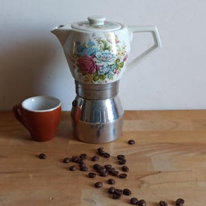 Classic italian stovetop moka pot with ceramic top, vintage espressomaker made in Italy