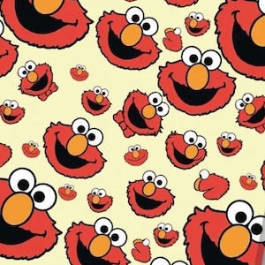 May include: A repeating pattern of Elmo faces on a pale yellow background. Each red character features large white eyes with black pupils, a bright orange nose, and a wide black mouth. The faces vary in size and orientation across the surface.