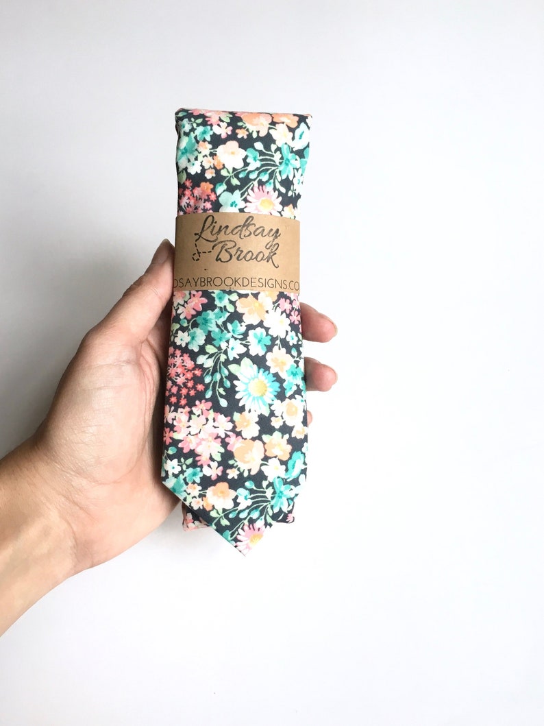 turquoise tie with navy suit