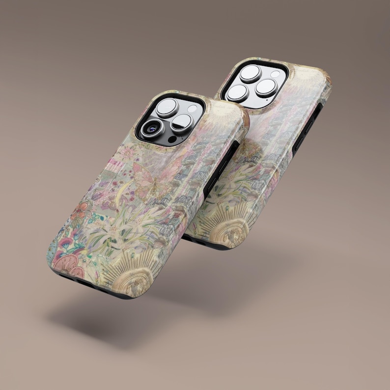 May include: Two phone cases with a floral design in pastel colors. The cases have a black border and a gold sunburst design on the bottom. The floral pattern includes pink, green, and yellow elements.