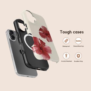 May include: A phone case with a floral design featuring two red hibiscus flowers on a cream background. The case is shown in layers, with a black inner case and a silver phone visible. The text "Tough cases" is displayed.