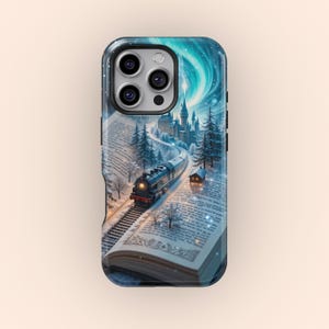 May include: A phone case with a winter scene of a train traveling through a snowy forest and a castle in the distance. The scene is printed on a book with a blue and white aurora borealis in the background.