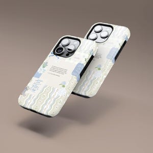 May include: Two white iPhone cases with a blue and white floral pattern. The cases have a quote printed on them. "I find in the second silence which is the silence of the soul, the world is waiting as the dawn is waiting, with a kind of expectant stillness, the most beautiful experience until the world is made new." - C.S. Lewis, Mere Christianity