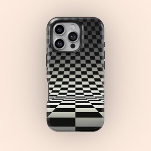 May include: Black and white checkered phone case with a 3D optical illusion design. The case has a black border and a camera cutout.